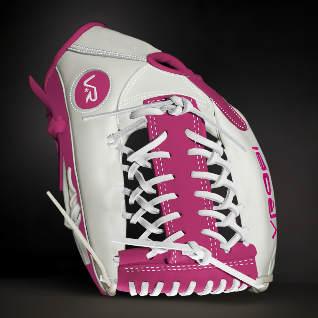 Pink and white softball glove on a black background